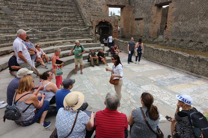 Explore Naples & Pompeii in One Day – Guided Half-Day Tour - Walking through Pompeii with a guide