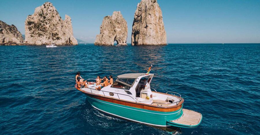 From Naples: Capri Boat Day Trip with Drinks - The Capri coast, from grottoes to Casa Malaparte