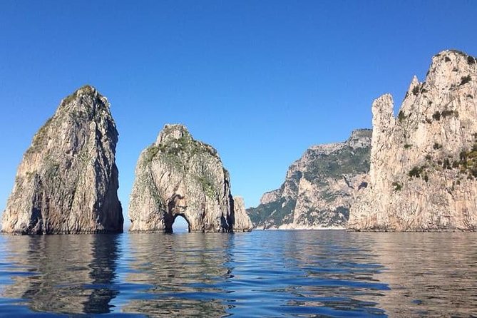 From Naples: Capri Island Tour with Lunch and Blue Grotto - Faraglioni and the coast by sightseeing boat
