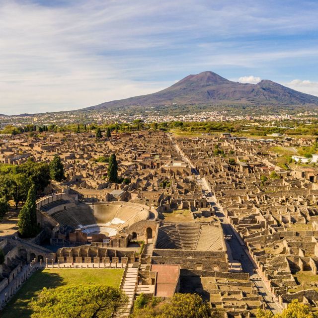 From Naples: Guided Pompei & Mount Vesuvius with Pizza Lunch - Walking through Pompeii’s Roman streets