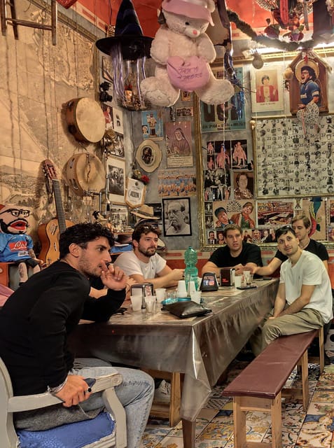 Naples: Authentic Family Home Lunch with Music Show & Spanish Quarters Tour - Entering a basso for lunch