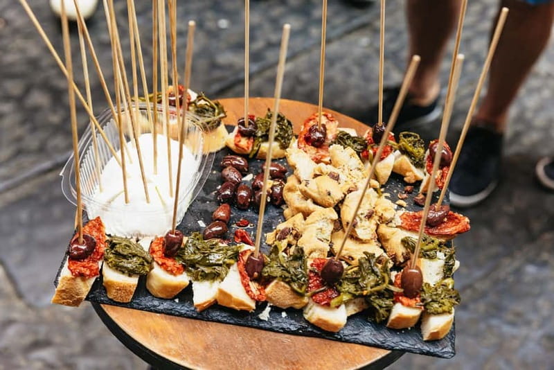 Naples: Guided Street Food Tour with Spritz - Starting among Greek ruins at Piazza Bellini