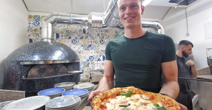 Naples: Pizza Making Class with Local Pizzaiolo - Stretching the dough into a Neapolitan shape