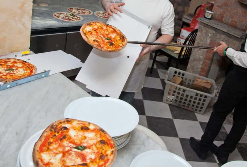 Naples: Premium Pizza-Making Class at a Pizzeria - Stretching and topping your Neapolitan pizza