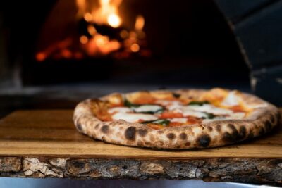 A margherita going into a wood oven in Naples