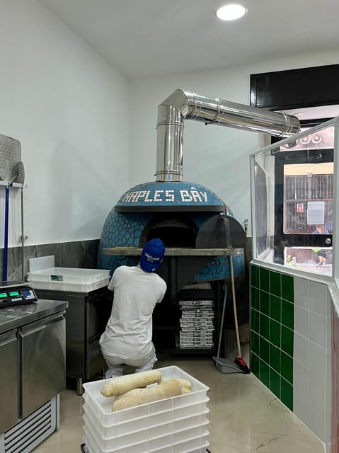 Pizza-Making Workshop by night with glass of wine - Arriving at Naplesbay Cooking Lab