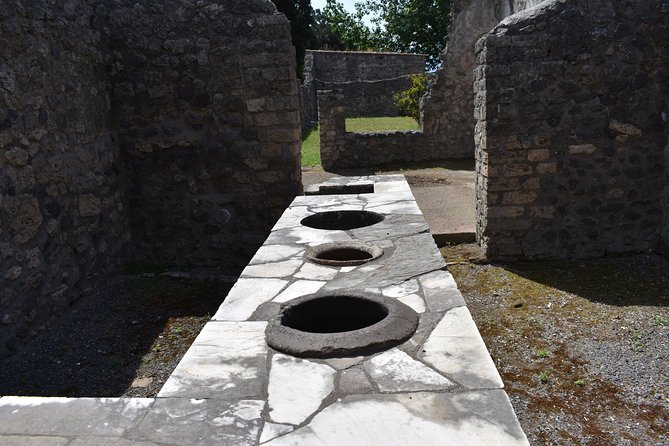 Pompeii Skip-the-line Tour with Archaeologist Guide - Baths, shops, and the everyday city