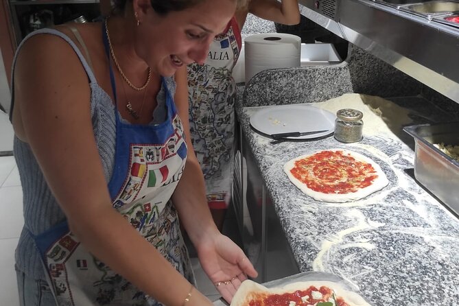 Semi-Private Pizza Making Experience in Naples with Drink - Choosing between margherita and marinara